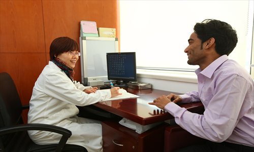 A foreign patient consults a general practitioner at the Huashan Worldwide Medical Center. Photo: Cai Xianmin/GT